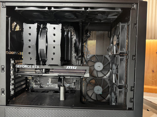 Internal view of a computer case with hardware components, including a GeForce RTX graphics card.

